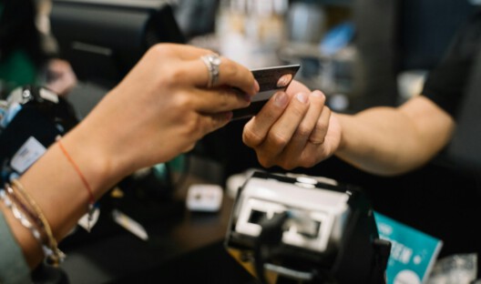 people exchanging a credit card