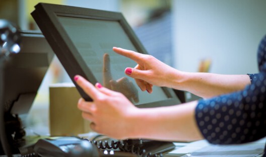 woman-using-POS-device-as-a-cashier