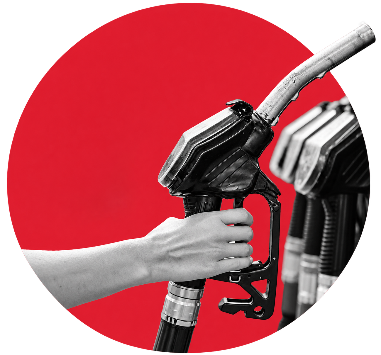 Hand holding fuel nozzle at dispenser.