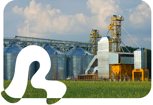 Exterior view of farm with large silos