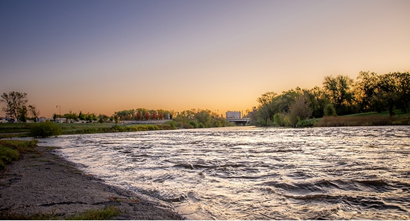View of Red River at sunset from shore